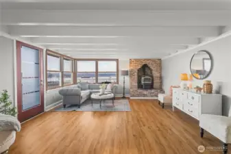 Along with views over Puget Sound, this living room offers easy access to the deck and back yard.