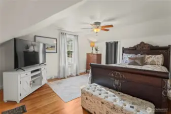 A second bedroom is just a few feet away. Fir floors continue and the window looks south.