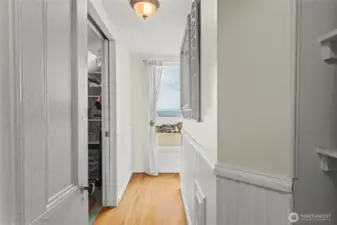 A door opens from the landing into this hall leading to a closet, another water view, and the 3/4 bath.