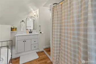 A 3/4 bath with a shower stall and vanity for storage completes the second floor.