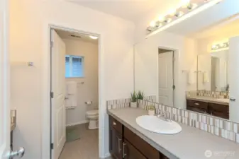 Main upstairs bathroom with 2 sink/vanity on each wall w/separate bath/toilet.
