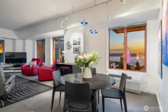 Dazzling evening views of Elliott Bay and the Seattle Great Wheel, creating a dramatic backdrop for entertaining.