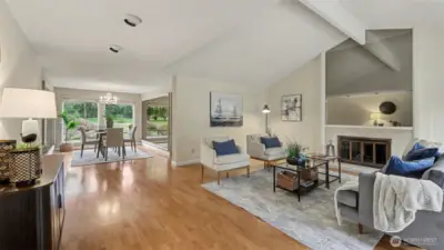 Bright, open living spaces flow seamlessly into the dining area, with expansive windows bringing in natural light and peaceful outdoor views.
