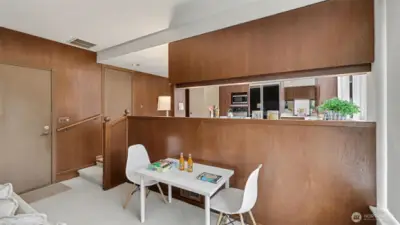 Enjoy this flexible space just steps from the kitchen, ideal for a small dining area, game table, or work-from-home setup.