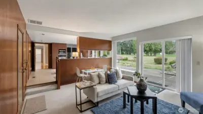 Relax in this inviting living area filled with natural light and seamless indoor-outdoor flow.