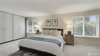 Unwind in this beautifully sized primary suite offering peaceful natural light and remarkable storage with an entire wall of closets.