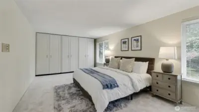 Spacious and inviting, this luxurious primary suite combines comfort, style, and impressive storage.