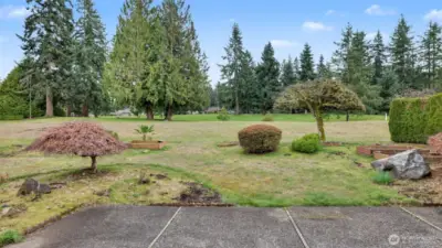 Enjoy morning coffee or evening gatherings with serene golf course views of the 8th hole.