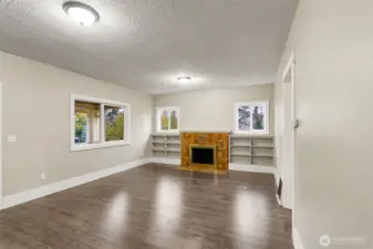 Cozy fireplace with built-in shelving.