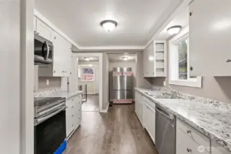 Inviting kitchen with white cabinetry and ample natural light.
