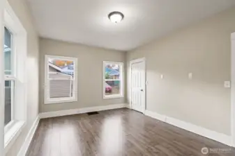 Spacious bedroom with ample natural light.