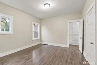 Bedroom with extra storage in hallway.