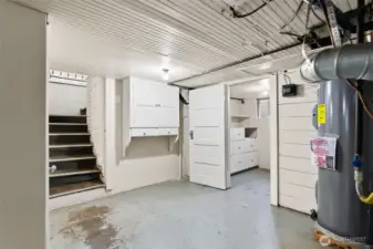 Lower level with stair access and storage space.