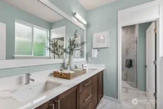 Virtual staging. Primary bathroom with thick slab quartz countertops, double undermount sinks and a large fully tiled shower