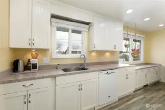 Abundant cabinets & Corian counter areas