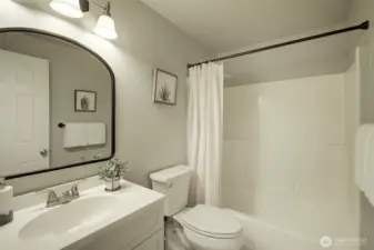 An additional full-sized bath is located upstairs, alongside bedrooms 2 & 3.