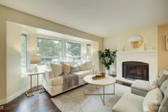 Cozy up to the fireplace on chilly nights.  This spacious living room offers plenty of natural light too.