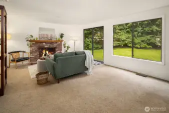 Back living room with plenty of natural light and easy access to the large back yard.