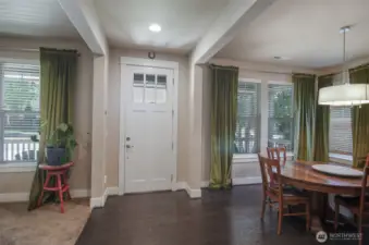 View of entry. Notice the high ceilings and door.