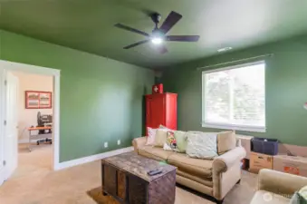Check out this upstairs bonus room, with bedroom off to the left.