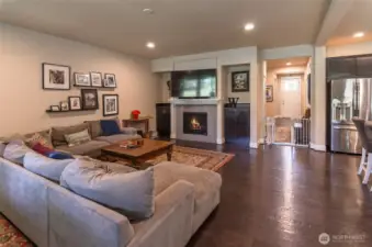 View showing TV area.  Notice the built-in cabinetry, gas fireplace and mantle.