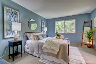 You'll love this main floor primary bedroom. Calm and serene.