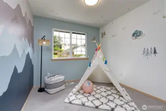 Custome mural adorn this lovely room.