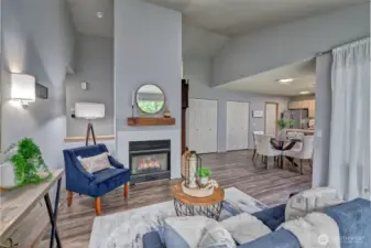 Living room adjacent to dining room and kitchen.