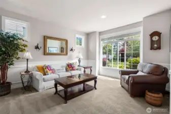 Bright and airy living room right off of the entrance