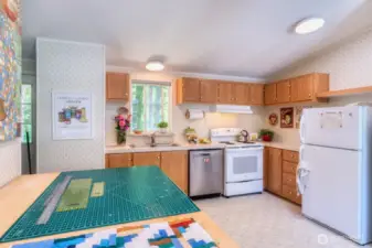 Kitchen with convenient access to back {mtn view} deck.