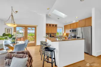 Deck off the dining area and extra seating at the kitchen island