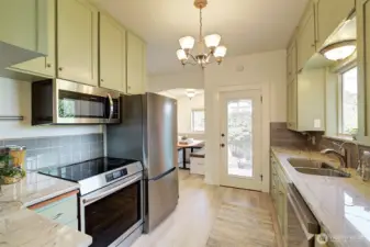Updated kitchen boasts new appliance, fixtures and flooring!