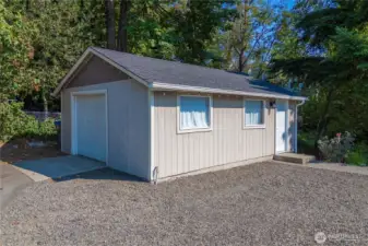 Detached 1 car garage has tons of space for storage and is wired for power.