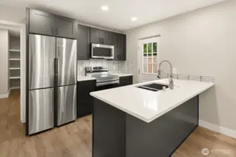 Luxury kitchen with custom cabinets, Quartz counters and luxury SS appliances.