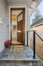 From the moment you arrive, the home’s craftsmanship is evident in every detail. The stamped concrete driveway adds a touch of sophistication and texture, setting the stage for what’s inside. A thoughtfully designed covered entry creates a warm, inviting welcome for guests and a grand first impression for homeowners.