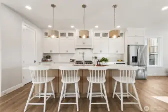 The oversized island provides the perfect space for meal prep, serving, and casual dining. A wonderful place to  gather, creating memorable moments over shared meals and conversation.