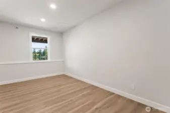 Bedroom #4 on lower level, with an adjacent large 3/4 bath.