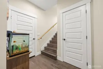 Main floor stairway. Door 1 goes to the garage, door 2 is a closet