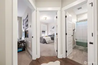 Main floor Bedroom 2, Bedroom 3, and the full bathroom.