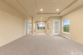 Another view of the spacious dining area with large windows, which allows more light and views of valley below.  Door to the left leads to the utility room.
