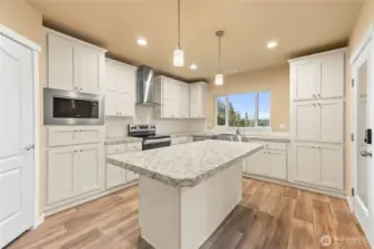 Kitchen has large eat-in island.  Island is a great space for anyone who loves to cook!