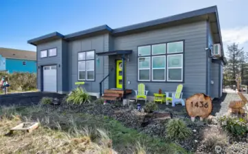 With the low maintenance landscaping and the bright and welcoming door, this beachy gem draws you right in.