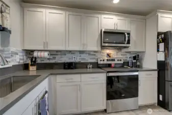 Stunning custom tile backsplash.