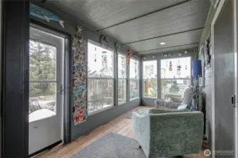 Enclosed sun room, as seen from the primary suite entry.