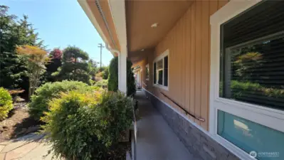 Front custom ramp and railing under the eaves of the house