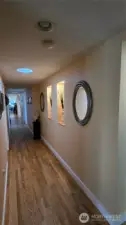 Upstairs hallway with lighted inserts for art display