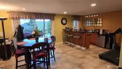 Open floor plan downstairs with bar and dinning area