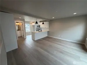 Subject property. Open kitchen/living floor plan. Door to the left is the powder room