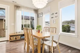 Windows surround this charming dining room with access to backyard where a gas line is directly plumbed to BBQ for easy entertaining.
