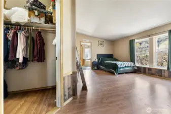 Primary bedroom with bathroom and walk in closet